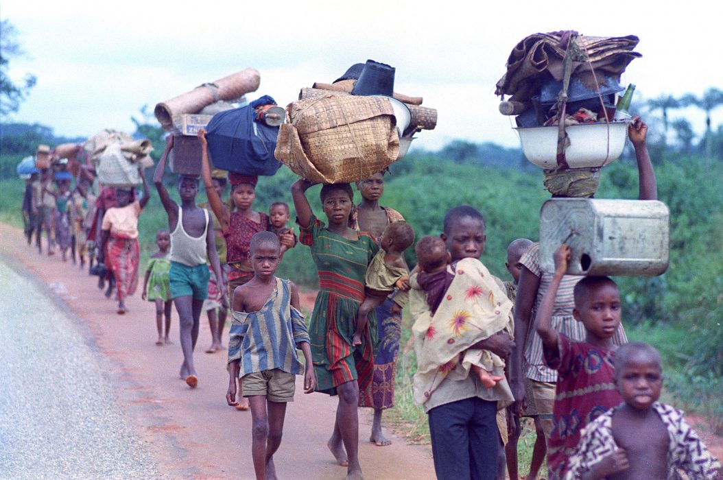** FILE ** Biafran refugees flee federal Nigerian troops on a road near Ogbaku, Nigeria in this Aug. 5, 1968 file photo. Between 1 and 3 million people are estimated to have died, mostly through starvation, during the first, failed attempt by the main Igbo ethnic group of the region to create an independent Biafra Republic between 1967-1970. The Movement for the Actualization of the Sovereign State of Biafra, which since 1999 has been trying to revive the campaign for independence, has struck chords among many Igbo _ but most of them are too young to have witnessed the horrors of the war. (AP Photo/Kurt Strumpf, File)