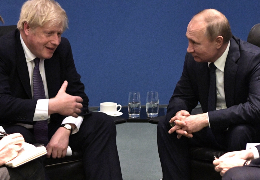 Storbritanniens premiärminister Boris Johnson och Rysslands president Vladimir Putin under ett möte i Tyskland i januari i år.