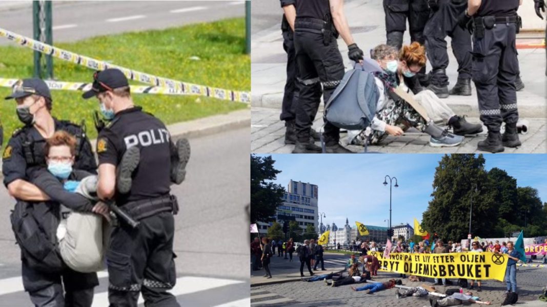 Tatjana Boric-Persson bärs bort av polis efter att ha blockerat en gata i centrala Oslo.
