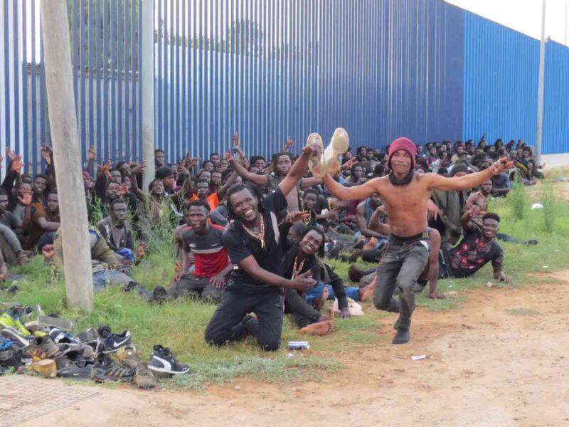 En grupp migranter som flytt krig och fattigdom söder om Sahara firar att de tagit sig in i den spanska enklaven Melilla i Afrika.